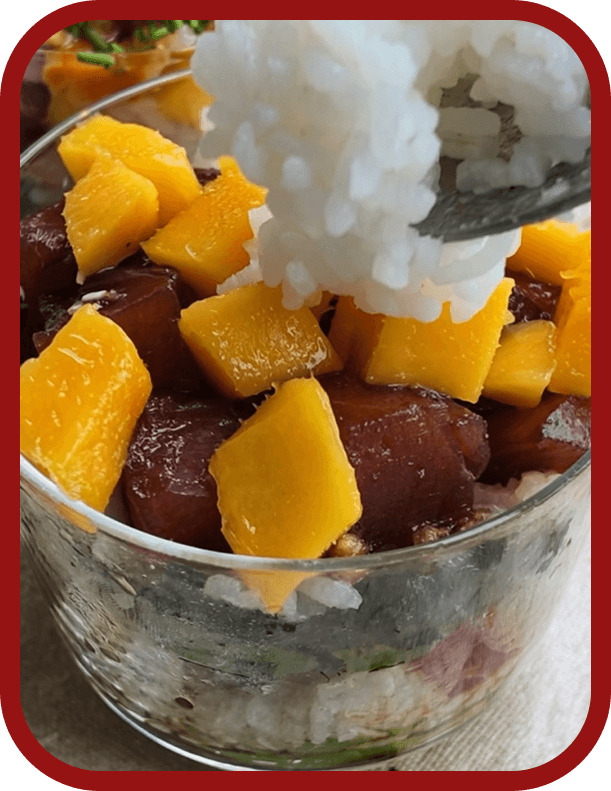 assembling-tuna-poke-dot-cake Layering sticky sushi rice, marinated ahi tuna, avocado, cucumber, mango, and seaweed to assemble a Tuna Poke Dot Cake.