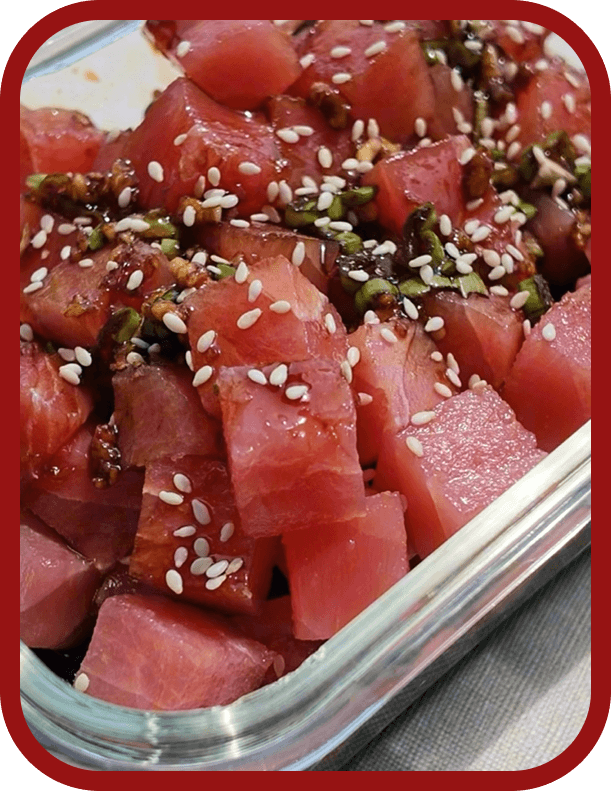 marinating-ahi-tuna-poke-cube Marinating Nutrafarms Ahi Tuna Poke Cubes with soy sauce, sesame oil, garlic, honey, and green onions.